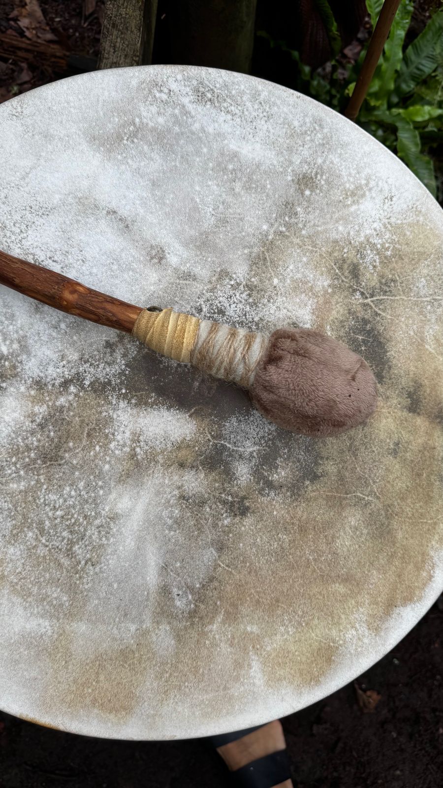 A hand drum and beater